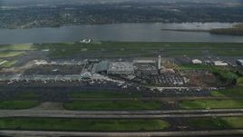5.5K aerial stock footage approaching Portland International Airport in Oregon and tilt down to terminals Aerial Stock Footage | AX153_133E