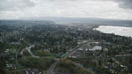 5.5K aerial stock footage flying over Camas to approach tract homes and the Washougal River in Washougal, Washington Aerial Stock Footage | AX153_159E