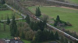 5.5K aerial stock footage tracking a train in Washougal, Washington Aerial Stock Footage | AX153_172