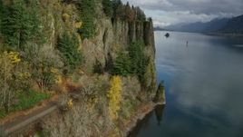 5.5K aerial stock footage approaching train tracks and tunnel in the Columbia River Gorge, Oregon Aerial Stock Footage | AX154_004E