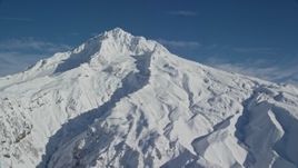 5.5K aerial stock footage of Mount Hood with snowy slopes, Mount Hood, Cascade Range, Oregon Aerial Stock Footage | AX154_081E