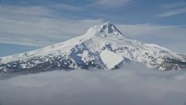 5.5K aerial stock footage of low clouds and Mount Hood, Cascade Range, Oregon Aerial Stock Footage | AX154_110