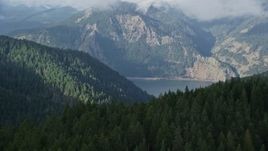 5.5K aerial stock footage flying over forest to reveal the Columbia River Gorge, Hood River, Columbia River Gorge, Oregon Aerial Stock Footage | AX154_151E