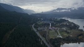 5.5K aerial stock footage approaching and flying over I-84 and the small town of Cascade Locks, Oregon in Columbia River Gorge Aerial Stock Footage | AX154_165E