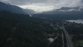 5.5K aerial stock footage flying over forest by Interstate 84, Cascade Locks, Oregon in Columbia River Gorge Aerial Stock Footage | AX154_168