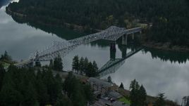 5.5K aerial stock footage flying over small town RV park and hotel to approach the Bridge of the Gods, Cascade Locks, Oregon in Columbia River Gorge Aerial Stock Footage | AX154_172E