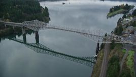 5.5K aerial stock footage of a reverse view of the Bridge of the Gods in Cascade Locks, Columbia River Gorge, Oregon Aerial Stock Footage | AX154_174
