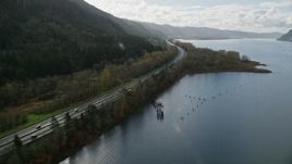 5.5K aerial stock footage flying by Interstate 84 highway with light traffic on the Oregon side of Columbia River Gorge Aerial Stock Footage | AX154_190E