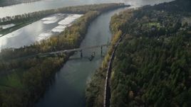 5.5K aerial stock footage tracking a barge and the Highway 14 bridge over Columbia River to Lady Island, Vancouver, Washington Aerial Stock Footage | AX154_214
