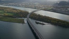 5.5K aerial stock footage of I-205 Bridge and the Columbia River with godrays shining down, Vancouver, Washington Aerial Stock Footage | AX154_218E