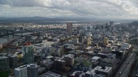 5.5K aerial stock footage flying by downtown skyscrapers and Interstate 405 with Willamette River in the background, Downtown Portland, Oregon Aerial Stock Footage | AX154_240E