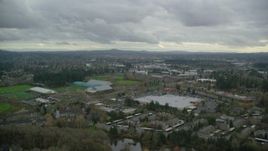 5.5K aerial stock footage flying over shopping center and Tualatin Hills Sports Complex, approach Nike Headquarters, Beaverton, Oregon Aerial Stock Footage | AX155_008