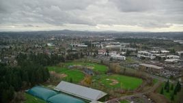 5.5K aerial stock footage flying over shopping center and Tualatin Hills Sports Complex, approach Nike Headquarters, Beaverton, Oregon Aerial Stock Footage | AX155_008E
