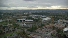 5.5K aerial stock footage of Nike Headquarters office buildings with construction cranes, Beaverton, Oregon Aerial Stock Footage | AX155_010