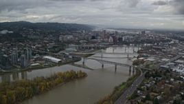 5.5K aerial stock footage flying by Ross Island Bridge near Downtown Portland, Oregon, and South Waterfront condo high-rises Aerial Stock Footage | AX155_024