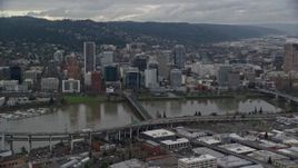 5.5K aerial stock footage of Ross Island Bridge, the Hawthorne Bridge, and skyscrapers in Downtown Portland, Oregon Aerial Stock Footage | AX155_046