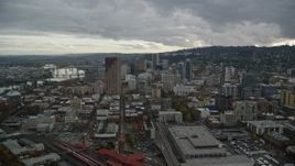 5.5K aerial stock footage flying away from skyscrapers, downtown buildings, and US Bancorp Tower, reveal Willamette River in Downtown Portland, Oregon Aerial Stock Footage | AX155_053E
