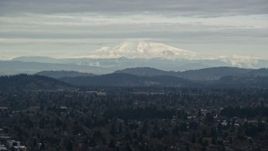 5.5K aerial stock footage of snowy Mount Hood seen from suburban residential neighborhoods in Portland, Oregon Aerial Stock Footage | AX155_062