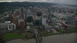 5.5K aerial stock footage following Hawthorne Bridge toward riverfront park and skyscrapers in Downtown Portland, Oregon Aerial Stock Footage | AX155_070E