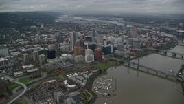 5.5K aerial stock footage of a view of Downtown Portland cityscape and waterfront park seen from the bridges over the Willamette River in Oregon Aerial Stock Footage | AX155_094
