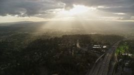5.5K aerial stock footage of godrays shining on neighborhoods and Highway 26, Southwest Portland, Oregon Aerial Stock Footage | AX155_118E