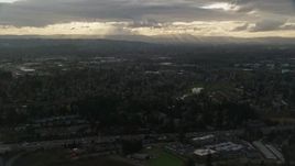 5.5K aerial stock footage flying by suburban neighborhood with a lot of trees in Beaverton, Oregon, sunset Aerial Stock Footage | AX155_123