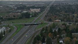 5.5K aerial stock footage following Highway 26 with light traffic through Hillsboro, Oregon, twilight Aerial Stock Footage | AX155_128