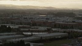 5.5K aerial stock footage of Intel Ronler Acres with godrays in the background, in Hillsboro, Oregon, sunset Aerial Stock Footage | AX155_130