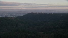 5.5K aerial stock footage of Mount Hood and Downtown Portland at sunset, seen from forest and hills in Northwest Portland, Oregon Aerial Stock Footage | AX155_139