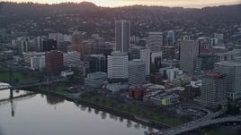 5.5K aerial stock footage of Downtown Portland skyscrapers and city park beside the Willamette River at twilight Aerial Stock Footage | AX155_154E