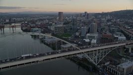 5.5K aerial stock footage orbiting heavy traffic crossing the Fremont Bridge at twilight, and reveal Downtown Portland, Oregon Aerial Stock Footage | AX155_158E
