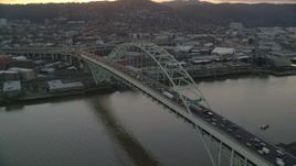 5.5K aerial stock footage orbiting heavy traffic crossing the Fremont Bridge at twilight, and reveal Downtown Portland, Oregon Aerial Stock Footage | AX155_159