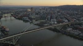 5.5K aerial stock footage flying over heavy traffic on the Fremont Bridge at twilight, approach Downtown Portland, Oregon Aerial Stock Footage | AX155_162
