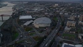 5.5K aerial stock footage following I-5 to Veterans Memorial Colosseum and Moda Center in Lloyd District, Portland, Oregon, twilight Aerial Stock Footage | AX155_175E