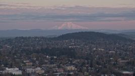5.5K aerial stock footage of Northeast Portland neighborhoods with Mount Hood in the distance at twilight, Oregon Aerial Stock Footage | AX155_177