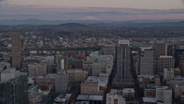 5.5K aerial stock footage of Mount Hood seen from US Bancorp Tower at twilight in Downtown Portland, Oregon Aerial Stock Footage | AX155_181
