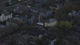 5.5K aerial stock footage tracking a gondola over apartment buildings at twilight and reveal a second gondola, South Portland, Oregon Aerial Stock Footage | AX155_194