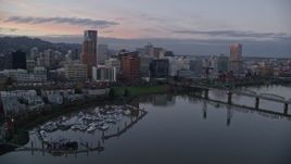5.5K aerial stock footage flying over Hawthorne Bridge, and pass the downtown skyline at twilight, Downtown Portland, Oregon Aerial Stock Footage | AX155_202