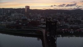 5.5K aerial stock footage of US Bancorp Tower at twilight, seen from the Steel Bridge, Downtown Portland, Oregon Aerial Stock Footage | AX155_206