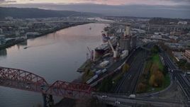 5.5K aerial stock footage approaching and fly over a cargo ship and grain elevator at twilight in North Portland, Oregon Aerial Stock Footage | AX155_207