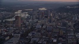 5.5K aerial stock footage flying by Downtown Portland cityscape by the Willamette River at twilight, Oregon Aerial Stock Footage | AX155_219