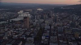 5.5K aerial stock footage of the Downtown Portland cityscape by the Willamette River at twilight, Oregon Aerial Stock Footage | AX155_220
