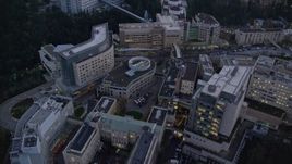 5.5K aerial stock footage approaching Oregon Health and Science University in the hills at twilight, Portland, Oregon Aerial Stock Footage | AX155_226E