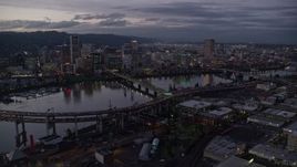 5.5K aerial stock footage of Downtown skyscrapers and bridges over the Willamette River at twilight, Downtown Portland, Oregon Aerial Stock Footage | AX155_249E