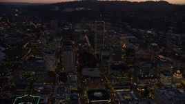 5.5K aerial stock footage following SW 3rd and 4th Avenues to approach KOIN Center and Wells Fargo Center at twilight, Downtown Portland, Oregon Aerial Stock Footage | AX155_263E
