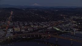 5.5K aerial stock footage of Mount Hood in the far distance, and warehouse buildings near the Willamette River, Southeast Portland, Oregon, twilight Aerial Stock Footage | AX155_266