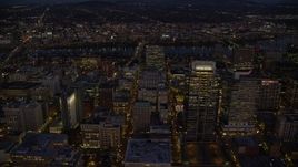 5.5K aerial stock footage flying by Park Avenue West Tower in downtown, and reveal US Bancorp Tower at night in Downtown Portland, Oregon Aerial Stock Footage | AX155_273