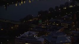 5.5K aerial stock footage of the White Stag sign and NW Naito Parkway at night in Downtown Portland, Oregon Aerial Stock Footage | AX155_276