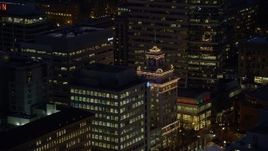 5.5K aerial stock footage tracking the top of Jackson Tower at night in Downtown Portland, Oregon Aerial Stock Footage | AX155_283