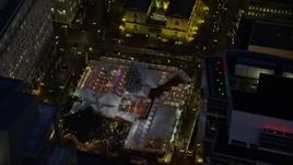 5.5K aerial stock footage orbit Pioneer Courthouse Square, decorated for Christmas, at night in Downtown Portland, Oregon Aerial Stock Footage | AX155_284E